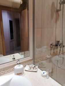 A bathroom at By the Waves luxury beach apartment