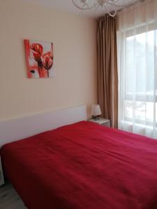 A bed or beds in a room at By the Waves luxury beach apartment