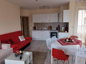 A kitchen or kitchenette at By the Waves luxury beach apartment