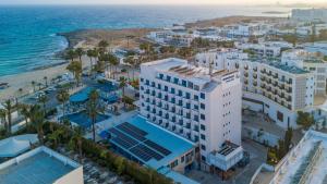 an aerial view of a hotel and the ocean at Anonymous Beach Hotel (Adults 16+) in Ayia Napa