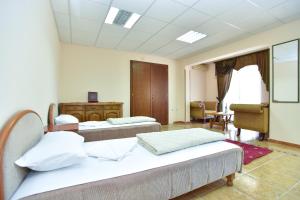 Postel nebo postele na pokoji v ubytování Hotel Grbalj