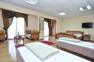 Postel nebo postele na pokoji v ubytování Hotel Grbalj