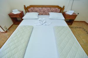 Postel nebo postele na pokoji v ubytování Hotel Grbalj