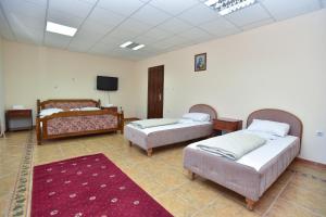 Postel nebo postele na pokoji v ubytování Hotel Grbalj