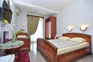 Postel nebo postele na pokoji v ubytování Hotel Grbalj