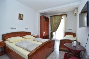 Postel nebo postele na pokoji v ubytování Hotel Grbalj