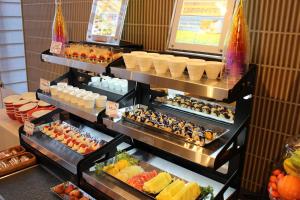 a display case in a buffet with food and drinks at Almont Hotel Nippori in Tokyo