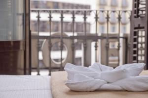 Posteľ alebo postele v izbe v ubytovaní Barcelona City Hotel