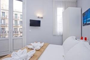 Posteľ alebo postele v izbe v ubytovaní Barcelona City Hotel