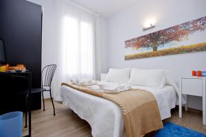 Posteľ alebo postele v izbe v ubytovaní Barcelona City Hotel
