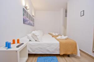 Posteľ alebo postele v izbe v ubytovaní Barcelona City Hotel