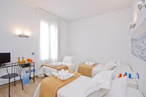 Posteľ alebo postele v izbe v ubytovaní Barcelona City Hotel
