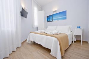 Posteľ alebo postele v izbe v ubytovaní Barcelona City Hotel