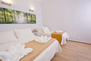 Posteľ alebo postele v izbe v ubytovaní Barcelona City Hotel