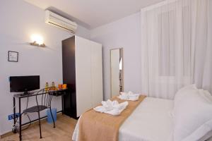 Posteľ alebo postele v izbe v ubytovaní Barcelona City Hotel