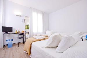 Posteľ alebo postele v izbe v ubytovaní Barcelona City Hotel