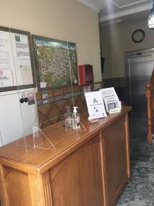 a wooden counter in a room with at Hostal Ana in Alhama de Granada