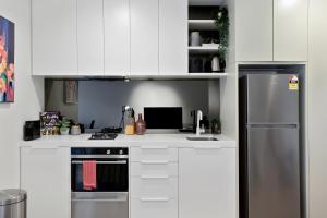 A cozinha ou cozinha compacta de Palmerston St Apartments by Urban Rest