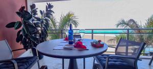 a table with a drink and a candle on a balcony at El Ancla in Tazacorte