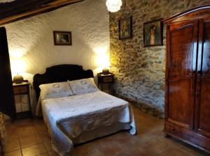 Llit o llits en una habitació de Casa Fuensanta balcón al mar de la Alpujarra