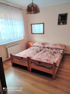 Ein Bett oder Betten in einem Zimmer der Unterkunft Apartament Bieszczady