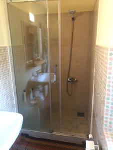 a bathroom with a shower and a sink at Predel House in Log pod Mangartom