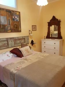 Postel nebo postele na pokoji v ubytování Ca Balossa, Tremezzina lago di Como davanti a Bellagio e villa Balbianello