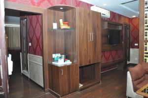 a room with wooden cabinets in an rv at Hotel JSR Continental in Dehradun