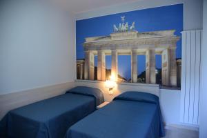 Tempat tidur dalam kamar di B&B Europa