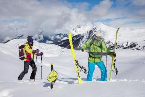 two people are standing in the snow with skis at Chalet Bouquetin- Chamois 8 to 11 people in Champagny-en-Vanoise