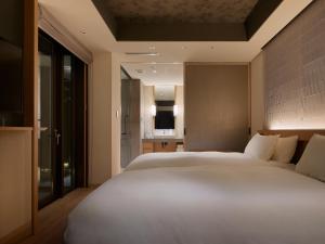 Cama ou camas em um quarto em Agora Tokyo Ginza