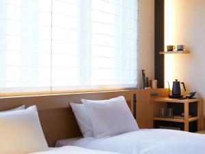 Cama ou camas em um quarto em Agora Tokyo Ginza