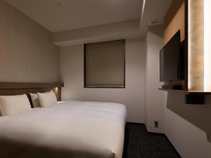 Cama ou camas em um quarto em Agora Tokyo Ginza
