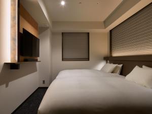 Cama ou camas em um quarto em Agora Tokyo Ginza
