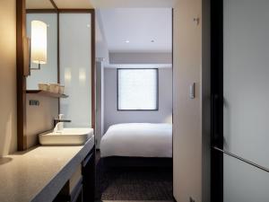 Cama ou camas em um quarto em Agora Tokyo Ginza