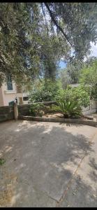 a parking lot in front of a house at Becici rooms in Becici