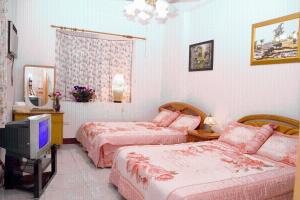 Posteľ alebo postele v izbe v ubytovaní Yilan Xiang Feng Homestay