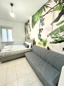 A bed or beds in a room at LE PALME Loft Apartment