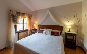 A bed or beds in a room at Agriturismo dalla Mimmi