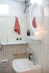 a bathroom with a sink and a mirror at Akratos wine house in Nydri