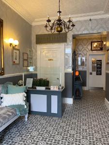 a living room with a couch and a table at The Clovelly in Llandudno