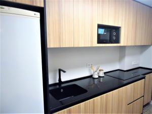 Kuchyňa alebo kuchynka v ubytovaní Torre Irta Family Complex LEK