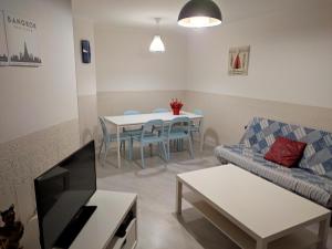 a living room with a couch and a table at Apartseu in La Seu d'Urgell