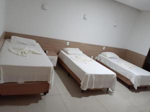 Cama o camas de una habitación en Rosa Vilma Hotel