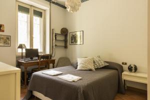 Posteľ alebo postele v izbe v ubytovaní Lemon Tree Apartment Sistine Chapel