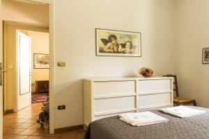 Posteľ alebo postele v izbe v ubytovaní Lemon Tree Apartment Sistine Chapel