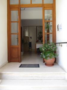 
a room with a door leading to a room with a door leading to a at Michael Apartments in Rethymno
