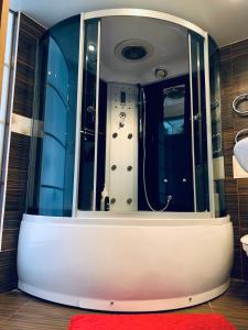 a bathtub in the middle of a room at City Centre Apartment on Krylenko 7 in Mogilev