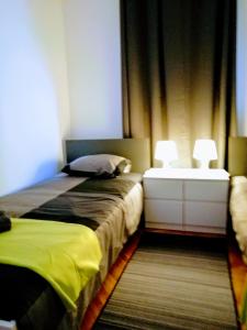 Posteľ alebo postele v izbe v ubytovaní Pula Center Arena Belvedere Apartments and Rooms