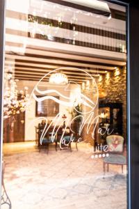 a window of a store with a sign on it at Maremar Suites in Benidorm